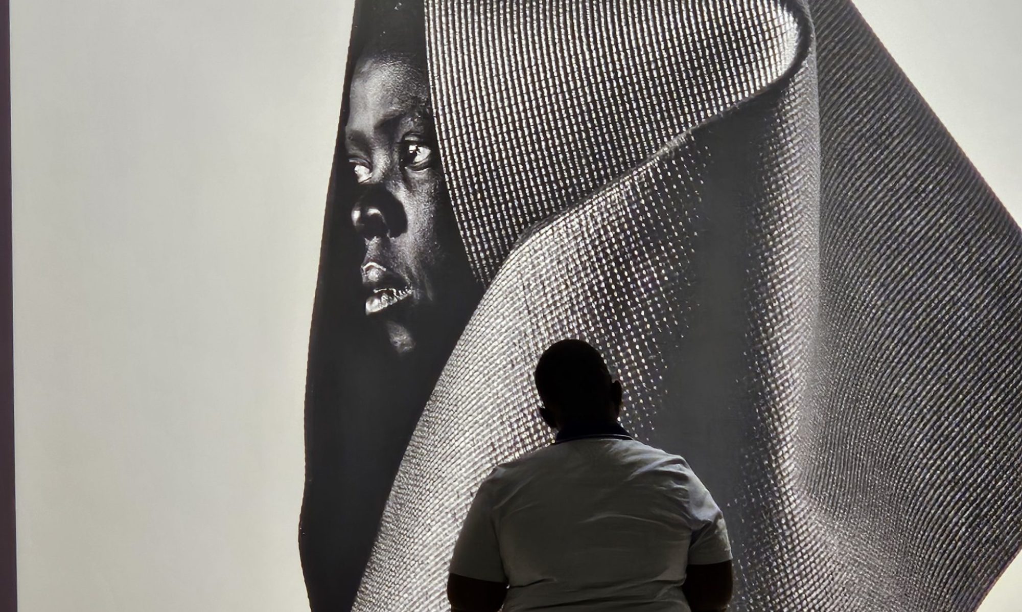 Blind student looking at art at the SCAD Museum